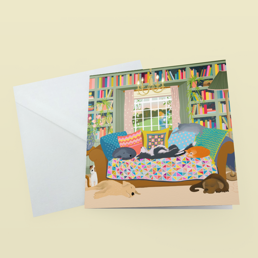 Greetings card. Cats and Dogs on a sofa