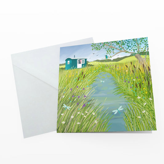 The Shepherds Hut greetings card. Perfect for the countryside lover in your life. Rural scene with water, wildflowers and dragonflies.
