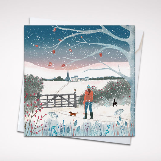 Snowy Village, Winter Country Scene Christmas Card. Featuring winter walks with dogs. Can be personalised.