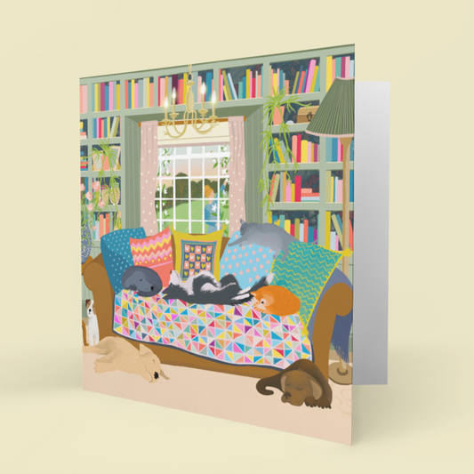 Greetings card. Cats and Dogs on a sofa