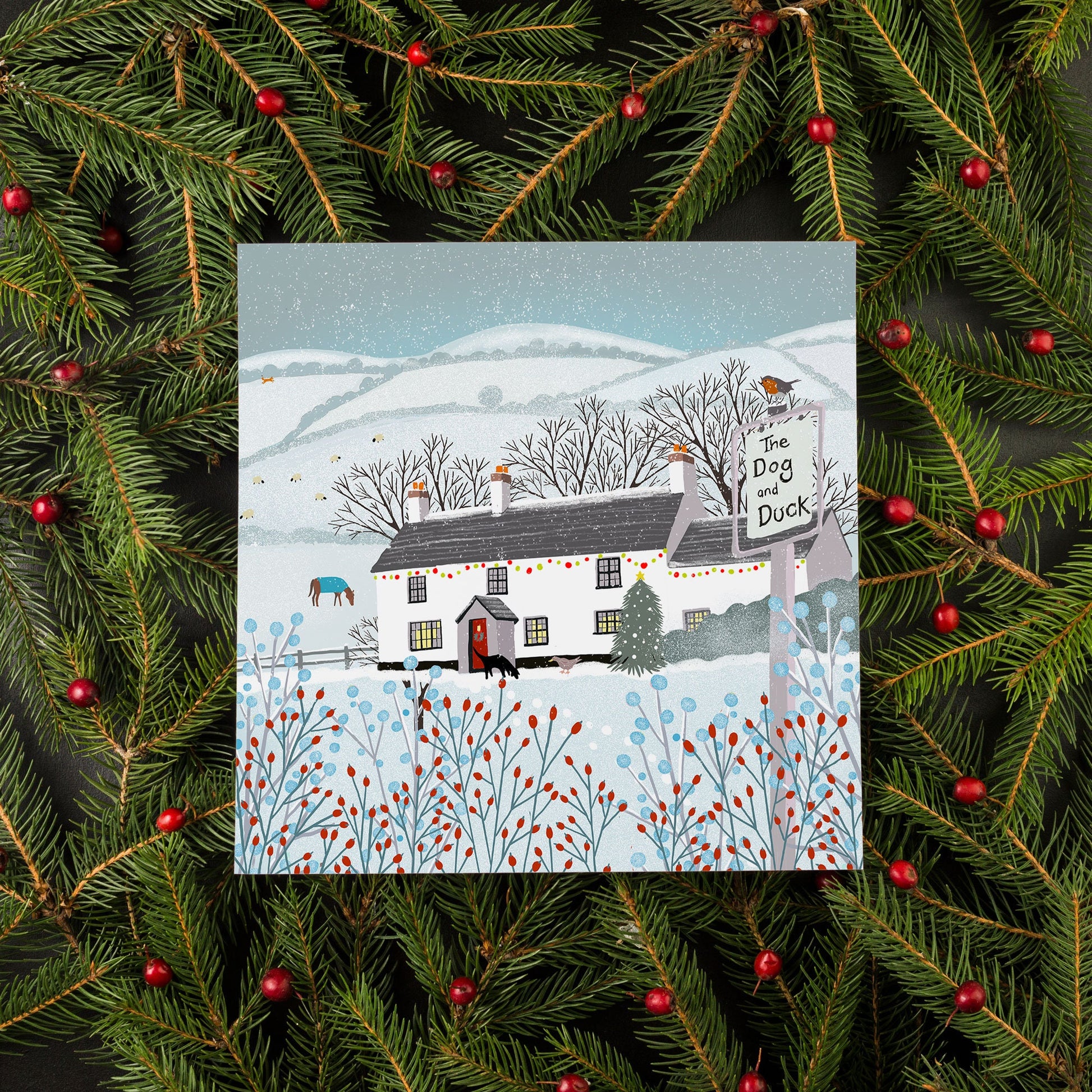 Christmas card, Dog & Duck Pub, A Country Christmas. Cards from original art featuring cosy country scenes, designed and printed in Scotland