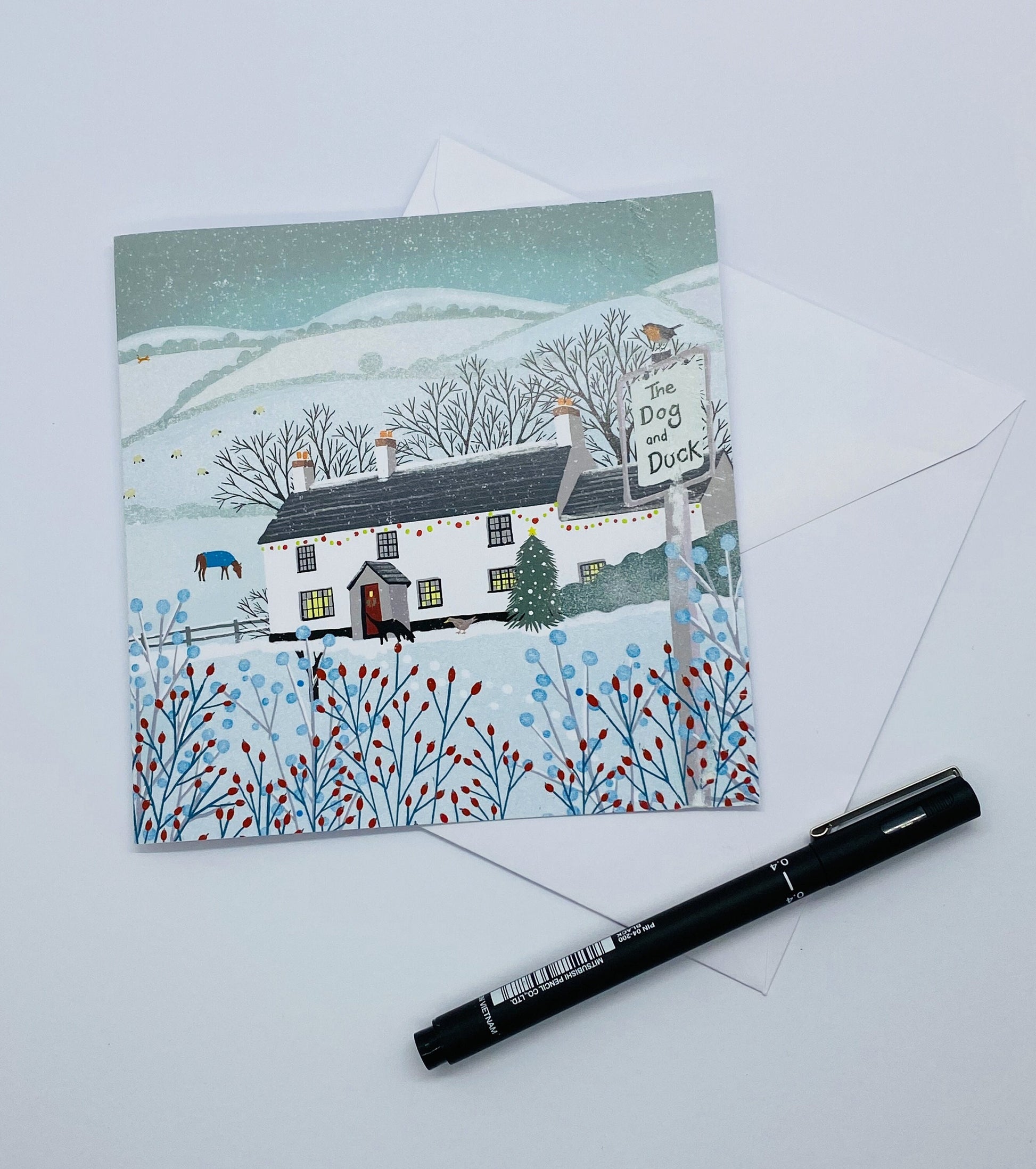 Christmas card, Dog & Duck Pub, A Country Christmas. Cards from original art featuring cosy country scenes, designed and printed in Scotland