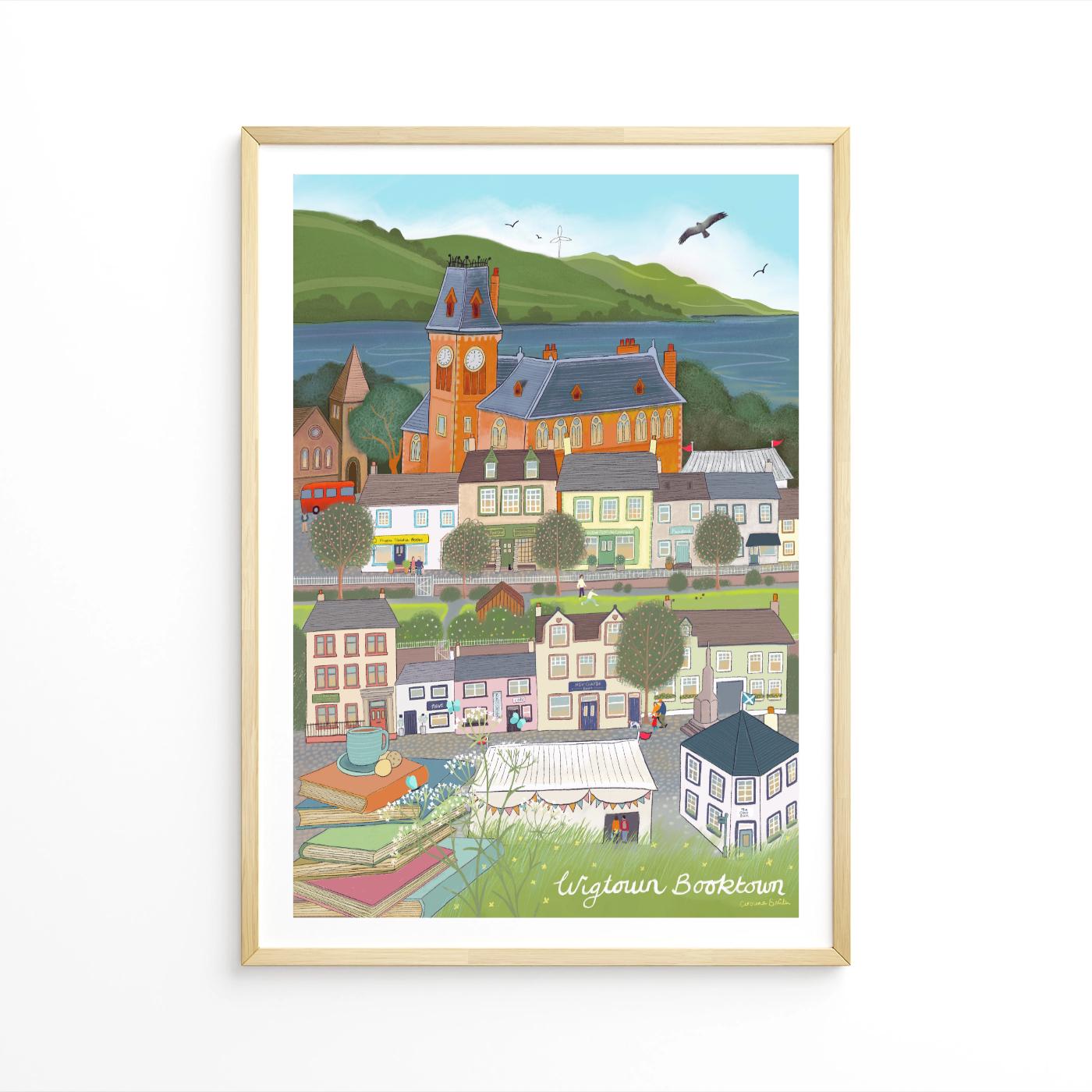 Framed artwork of a colorful village scene with a clock tower.