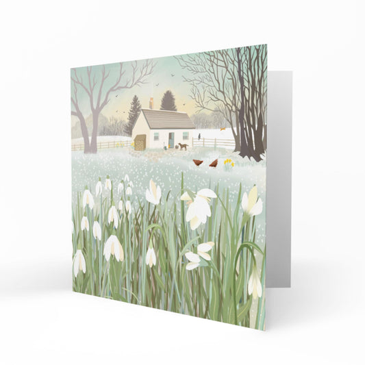 Snowdrop Croft Greetings Card: Frosty Winter Scene with a cottage and snowdrops, Caroline Smith Art
